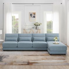 a living room with a blue sectional couch