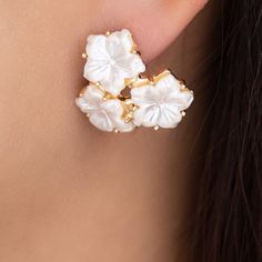 Lightweight Material: gold plated brass Drop: 0.75" For pierced ears IMPORTED Gold Clip-on Flower Shaped Jewelry, Gold Plated Flower Earrings For Pierced Ears, Pierced Flower-shaped Gold Plated Jewelry, Gold Flower Cluster Earrings For Pierced Ears, White Gold Plated Flower Earrings, White Gold-plated Flower Earrings, White Gold Plated Clip-on Earrings, White Cluster Earrings With Flower Shape, White Flower Shape Cluster Earrings