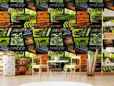 a child's room decorated in green and orange wallpaper with cars on it