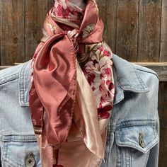 Our classic wild rag/scarf in a raspberry pink with a floral pattern. A perfect square - measuring 35"x35". Adding that extra touch of a western style to your outfit. 100% soft silk feeling polyester is durable to keep you warm in the cold and fashionable for any occasion. Plus it's machine washable!  Additional accessories are available- (Please see our slide options on our site)  *Leather slides *Western concho slides *Crystal concho slide  *Buckle slides Pink Square Silk Scarves, Pink Shawl Scarf For Fall, Pink Shawl Scarves For Fall, Pink Silk Square Scarf For Spring, Pink Square Silk Scarf For Spring, Vintage Pink Silk Scarf For Spring, Pink Elegant Scarf For Fall, Pink Bohemian Scarf For Fall, Pink Bohemian Scarves For Fall