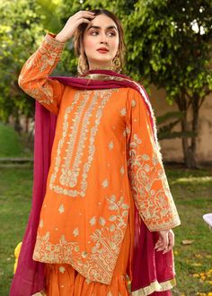 Description Shirt : Orange raw-silk shirt with Embroidery. Trouser : Orange raw-silk Gharara with Embroidery. Dupatta : Reddish maroon chiffon dupatta. Diwali Raw Silk Dress With Naqshi Detailing, Diwali Raw Silk Dress With Naqshi, Red Unstitched Sharara With Naqshi Detailing, Traditional Drape Sharara In Cambric With Dabka, Traditional Drape Cambric Sharara With Dabka, Festival Chinon Palazzo Set, Designer Sharara With Zari Work In Cambric, Red Sharara With Naqshi For Eid, Festive Chanderi Sharara With Naqshi Detail