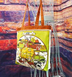 What day was your birthday on in 1976?? Now you can look it up anytime you are packing this handy dandy, fun upcycled tote!   The outside of the bag is a repurposed linen calendar towel from 1976.  It features a farm scene with everything - barns, cows, pigs, sheep and chickens. Ma and Pa and lots of kids too!  And their truck, of course. The other side of the tote is all the months of the year, so you can just look up those dates easy as can be.   The top of the tote and the straps a reddish br Retro Upcycled Tote Bag, Retro Upcycled Bag For Everyday Use, Vintage Upcycled Tote Bag, Upcycled Tote, All The Months, Plaid Backpack, Plaid Purse, Vintage Calendar, Tan Purse