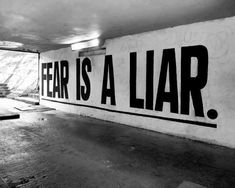 there is a sign that says fear is a liar