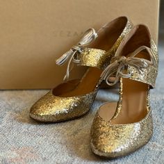 Stunning Glittery Gold Heels From Sezane, New Never Worn And Still Has The Plastic Liner Intact On The Bottom Soles! These Are Absolutely Positively Gorgeous. I’ve Had Them For Years And Sadly Never Wore Them. I’m Hesitant To Sell, But They Deserve To Be Worn And Loved! They Have An Old World, Vintage, Flapper Vibe To Them And They Definitely Have The Wow-Factor! Great For Weddings, New Years Eve, Or Your Next Formal Event. Euro 37, Best Fits Us 6.5/7. From A Smoke/Pet Free Home. Glitter Gold, Gold Heels, Wow Factor, Wow Products, New Years Eve, Gold Glitter, Formal Event, Old World, Shoes Women Heels