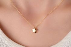 Our star charm necklace is made of 14k solid gold. It has a dainty and minimalist style that everyone from 7 to 70 loves it!  This small star will accompany you everywhere. It looks like a puffed star. (The front and back do not look the same.) The chain passes through one corner of the star. When you consider our minimalist gold star necklace as a gift, it will make your loved ones happy on their birthday, mother's day, valentine's day, anniversaries, graduation, or women's day. It will be a perfect gift! 🌟 🎁 If you want, you can add a gift note for your loved ones. It arrives in a special jewelry gift box. ✨ We respond to your questions happily. Your question will be answered within 24 hours. Do not hesitate to contact us. 💎 I hope you have a lot of Onseva's designs. :) a.b.-G Minimalist Star Of David Necklace For Everyday, Minimalist Star Necklace For Everyday, Minimalist Star Charm Necklace, Elegant Star-shaped Charm Necklace For Everyday, Dark Pearl Necklace, Dark Pearl, Gold Necklace Dainty, Gold Star Necklace, Wave Pendant