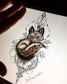 a drawing of a fox sleeping on top of a piece of paper