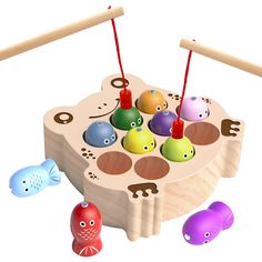 a wooden toy with different colored toys in it