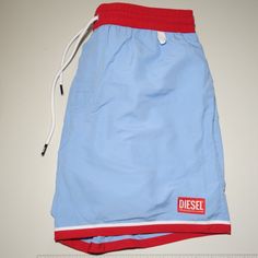 Diesel Bmbx Wave-B Solid Blue And Red Accents Beachwear Swim Shorts With A Quick-Dry Finish, Crafted Using Certified Recycled Polyester. * New With Tags * Usps Tracking Included * Sourced From The Reuse Sector. Size - Large Gift Suggestions - Luxury - Spring & Summer Item Condition Please Understand That Since These Items Are Vintage And/Or Recycled, They May In Fact Show A Little Sign Of Wear, Aging, Or Slight Discoloration. If We List Something As New Old Stock (Nos) Or New, It Will Be In Exce Blue Shorts For Beach In Summer, Blue Beach Shorts For Warm Weather, Blue Shorts For Beach And Warm Weather, Blue Shorts For Beach In Warm Weather, Casual Blue Shorts For Warm Weather, Blue Beachy Cotton Bottoms, Beachy Blue Cotton Bottoms, Beachy Blue Cotton Shorts, Blue Short Swim Trunks For Warm Weather