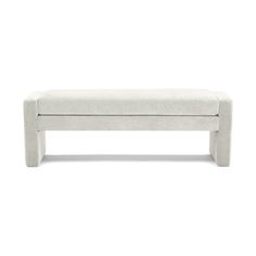 a white bench sitting on top of a white floor