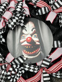 a close up of a wreath with a clown face on it