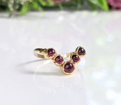 Ruby Chevron ring in 18k Gold - Moondrop Creations Yellow Gold Garnet Rings For Anniversary, Yellow Gold Garnet Birthstone Ring For Wedding, Ruby Open Ring With Bezel Setting For Wedding, Yellow Gold Garnet Promise Ring, Ruby Wedding Ring With Bezel Setting, Yellow Gold Hallmarked Ruby Ring For Wedding, Hallmarked Yellow Gold Ruby Ring For Wedding, Garnet Bezel Set Rings For Wedding, Ruby Birthstone Ring Stamped 14k For Wedding