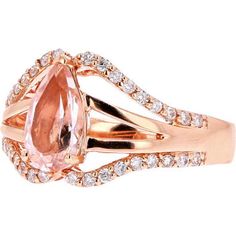 Behold the sparkle of sophistication in our captivating 14K Rose Gold Pear Center MoRose Goldanite Ring. Crafted to enchant, this ring features a lustrous pear-shaped moRose Goldanite as its centerpiece, radiating warmth and elegance. Embraced by a halo of shimmering diamonds totaling 0.35 Carats, this piece exudes a celestial allure that captivates the eye.Imagine the ethereal glow of the moRose Goldanite, delicately set in 14K rose gold, adorning your finger with timeless grace. The soft blush tones of the rose gold complement the rosy hues of the moRose Goldanite, creating a harmonious union of color and radiance. With a total carat weight of 1.13 Carats for the moRose Goldanite, this ring is a true testament to refined luxury and feminine allure.Indulge in the romance and splendor of o Elegant Teardrop Morganite Rings, Rose Gold Pear-shaped Ring With Brilliant Cut, Rose Gold Pear-shaped Diamond Ring With Prong Setting, Rose Gold Teardrop Brilliant Cut Ring, Formal Rose Gold Pear-shaped Diamond Ring, Elegant Pink Teardrop Ring, Elegant Rose Gold Pear-shaped Diamond Ring, Elegant Pear-shaped Rose Gold Diamond Ring, Luxury Rose Gold Teardrop Rings