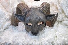 This mask takes a minimum of 3-5 weeks to make. The horns are shipped not attached, some assembly required. Welcome mask lovers! This is a one-of-a-kind piece of art that can be worn or used as a decoration. It is fun, decorative, and functional art. After being meticulously hand sculpted in polymer clay, a mold is created and the design is cast in resin to create a lightweight, durable reproduction. All of my resin masks start out as an original sculpture created in clay. I make a mold of the o Ram Mask, Ram Sculpture, Sheep Mask, Goat Mask, Aries Ram, Big Horn Sheep, Art Mask, Animal Mask, Theatre Masks