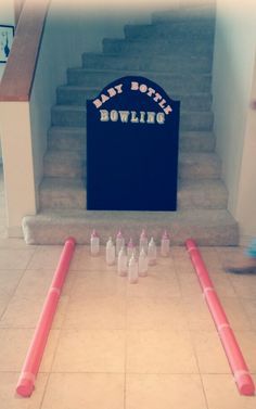 the bowling game is set up on the floor in front of the stairs and steps