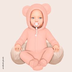 a baby in a pink bear suit sitting on a bean bag and holding a pacifier