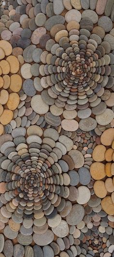 an image of a stone wall made out of rocks and pebbles in different colors, shapes and sizes