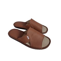 Comfortable, leather house men's slippers by Bosaco in gold-brown color. Their upper is made of high-quality natural leather, which guarantees durability and comfort of wearing. These summer flip flops feature a leather insert on the heel that adds style and durability, while being practical and stylish for all your warm-weather adventures. Mens slippers have a slightly wider cut. The wider shape of the summer slippers makes them perfect for people with wider and tall feet. The rubber sole provi Brown Open Toe Leather Shoes With Leather Lining, Comfortable Brown Slip-ons With Stitched Sole, Classic Brown Slippers With Leather Sole, Brown Leather Slip-on Slippers, Classic Brown Slides With Round Toe, Brown Cushioned Slip-on Slides, Brown Open Toe Mules With Stitched Sole, Classic Brown Round Toe Slides, Brown Leather Sole Slides, Slip-on Fit