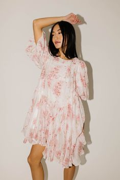 just as effortless as it is elegant, this flowy pink puff sleeve babydoll dress can be kept in rotation season after season. it features a stylish butterfly hemline + a minimalistic floral pattern. a must-have for family pictures + dressy date nights. pink // mini length, scoop neckline, dramatic balloon sleeves, elastic cuffs, back button closure, lined model is 5'8" + wearing a small measurements are approximate + taken while laying flat small : bust 34” length 35” medium : bust 36” length 36” Puff Sleeve Babydoll Dress, Puff Sleeve Dress, Puffed Sleeves Dress, Pink Mini, Large Bust, Balloon Sleeves, Babydoll Dress, Dress Pink, Family Pictures