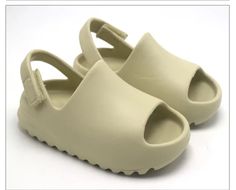 Toddler slides Velcro strap Unisex style Beige Slides For Summer Outdoor, Solid Color Open Toe Slides For Outdoor, Open Toe Slides For Outdoor, Casual Cream Slides, Trendy Outdoor Slides For Spring, Casual Slides With Adjustable Strap, Casual Slides With Adjustable Straps For Spring, Modern Adjustable Slides For Spring, Casual Cream Slides For Spring