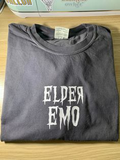 elder emo shirt Color graphite by comfort colors white screen print These are made to order. Designed, printed and handmade by me. Due to different monitor calibrations colors may be a tad off. They are very close to true colors. Other info: These items are packaged in poly mailers.  Free shipping when you spend $35 Connect: Instagram: christina_idesigns Emo Night Outfit, Emo Tshirt, Emo Night, Emo Shirt, Elder Emo, Emo Shirts, Emo Men, White Screen, Poly Mailers