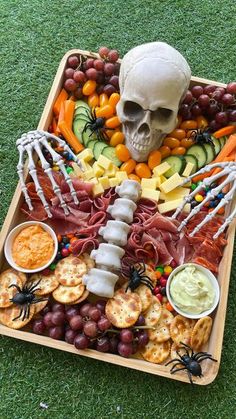 a skeleton sitting on top of a tray filled with food