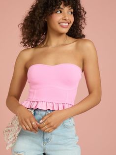 This feminine corset tube top with a peplum hem and a sweetheart neckline is the perfect top for a night out. The fitted silhouette is constructed from a snug yet stretchy material to ensure you have the perfect fit. Feminine Fitted Tube Top With Built-in Bra, Strapless Flirty Corset With Built-in Bra, Flirty Strapless Corset With Built-in Bra, Fitted Flirty Tube Top With Built-in Bra, Pink Ruffled Bandeau Tube Top, Fitted Corset With Boned Bodice And Elastane Material, Fitted Strapless Elastane Tube Top, Fitted Tube Top With Built-in Bra For Date Night, Fitted Corset With Boned Bodice In Elastane