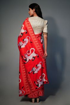 Red chanderi saree with all-over tiger and floral print. Comes with an unstitched plain golden lurex blouse fabric.
Components:2
Pattern: Printed
Type of Work: Floral, Tiger
Fabric: Saree: Chanderi; Blouse: Lurex
Color: Red
Other Details:
Note: The blouse worn by the model is not for sale
Occasion: Destination Wedding, Puja - Aza Fashions Red Kalamkari Print Lehenga For Festivals, Festive Kalamkari Print Pre-draped Saree, Red Unstitched Pre-draped Saree For Diwali, Festive Pre-draped Saree With Kalamkari Print, Red Kalamkari Print Choli With Traditional Drape, Red Kalamkari Print Lehenga In Traditional Drape, Red Kalamkari Print Lehenga With Traditional Drape, Chanderi Pre-draped Saree With Kalamkari Print For Puja, Red Lehenga With Kalamkari Print In Traditional Drape