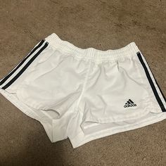 Nwot Adidas Shorts. Comfy. Athletic. Perfect Condition. Size Xs White Three Stripes Athletic Shorts For Sports, White Three Stripes Athletic Shorts, Adidas Sporty White Athletic Shorts, White Three-stripe Sports Shorts, White Athleisure Shorts With Three Stripes, White Stretch Bottoms With Three Stripes, White Shorts With Three Stripes For Spring, White Three Stripes Shorts For Spring, Adidas White Athletic Shorts With Built-in Shorts