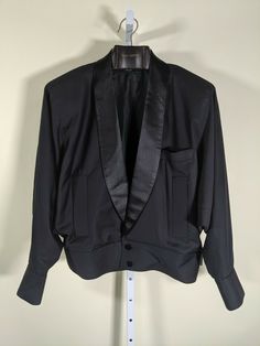 Pierre Cardin Vintage 60s Space Age Mod Deconstructed Tuxedo Bomber Jacket Excellent condition. Appears hardly worn. Incredible piece ahead of it's time, could be on runway in 2019. No size/care tag see measurements. Pit to pit: 23" Length: 26" Shoulders: 21" Shoulder to cuff: 25" Arm opening seam:  18" Retro Long Sleeve Semi-formal Outerwear, Retro Semi-formal Winter Outerwear, Long Sleeve Outerwear With Button Closure In Vintage Style, Retro Tailored Long Sleeve Blazer, Vintage Black Outerwear With Lapel Collar, Tailored Costume Blazer, 1950s Vintage Style Long Sleeve Outerwear, 1950s Vintage Long Sleeve Outerwear, 1950s Style Long Sleeve Vintage Outerwear