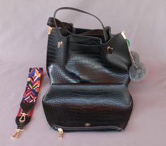 Details: Faux Snakeskin print Bag Length: 11.8" Bag Width: 5.11" Bag Height: 9.84" Additional makeup bag included Attached handles length: 5.5" Detachable Strap: 33.5" Included: tapestry strap, makeup bag. double pompoms & felt leaf Handheld Bucket Bag With Removable Pouch, Black Satchel With Removable Pouch Fashion Accessory, Faux Leather Shoulder Bag With Adjustable Strap, Shoulder Bag With Removable Pouch And Double Handle, Double Handle Shoulder Bag With Removable Pouch, Rectangular Hobo Bag With Detachable Strap, Felt Leaf, Snake Skin Bag, Felt Leaves