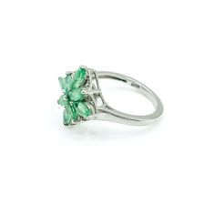 Sterling Silver Emerald Floral Ring Size 5. This Platinum plated Sterling Silver ring features eight marquise cut green Emerald stones prong set in a floral pattern. This makes a great birthday gift for a young lady. Emeralds symbolize love and truth and they are also the May Birthstone. Green is the color of life. It is often associated with nature, health, growth and prosperity. It represents hope for the future.Ring is pre-owned and in great condition. Buy with confidence knowing that all our Emerald Marquise Promise Ring For May Birthstone, Marquise Emerald Ring For Promise In May, Green Marquise Cut Emerald Ring, Formal Green Marquise Emerald Ring, Green Emerald Jewelry In Flower Shape, Green Marquise Emerald Ring For Anniversary, Green Emerald Flower-shaped Jewelry, Marquise Cut Green Emerald Ring With Prong Setting, Green Emerald Marquise Cut Ring With Prong Setting