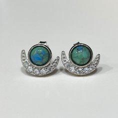 Sterling Silver Turquoise & White Topaz Moon Earrings...Marked 925...Total of weights 1.9grams...Measure of earrings H 10.8MM W 9.7MM... These are in very good condition. Turquoise Round Hallmarked Earrings, Blue Moon Shaped Sterling Silver Earrings, Blue Moon-shaped Sterling Silver Earrings, Turquoise Sterling Silver Nickel-free Hoop Earrings, Elegant Turquoise Nickel-free Crystal Earrings, Artisan Turquoise Nickel-free Earrings, Artsy Turquoise Nickel-free Earrings, Turquoise Southwestern Nickel-free Hoop Earrings, Sapphire Earrings Studs