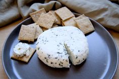 a plate with crackers and cheese on it