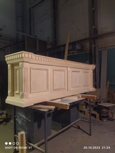 an unfinished cabinet being built in a workshop