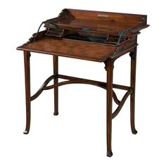 an antique wooden writing desk with leather top and drawer on one side, in the shape of a briefcase