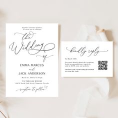 the wedding stationery is laid out on top of a white table cloth and some flowers