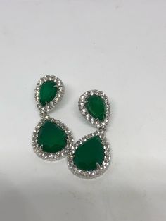 Over one inch long An Emerald green Quartz set in an ornate Sterling silver frame. Over an inch long All jewelry is shipped in a nice gift box. Check out our over a THOUSAND great reviews Green Pear-shaped Earrings For Formal Events, Classic Green Drop Earrings, Classic Green Earrings For Party, Green Drop Jewelry For Jewelry Making, Green Pierced Jewelry For Party, Classic Green Drop Jewelry, Nickel-free Green Drop Jewelry, Green Nickel-free Drop Jewelry, Green Teardrop Cubic Zirconia Jewelry