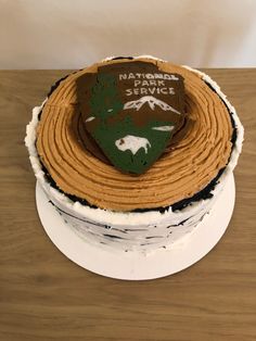 there is a cake that says national park service on the front and side of it