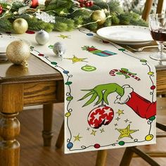 a christmas table runner with an elf on it