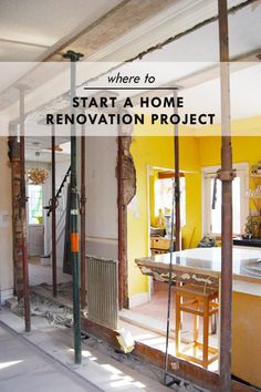 the inside of a home being remodeled with yellow walls and flooring, including an open kitchen