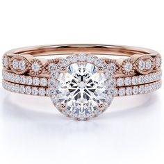 a rose gold engagement ring set with an oval center stone and two rows of diamonds on the band