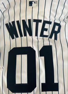 a baseball jersey with the number 10 on it is being displayed in front of a white background