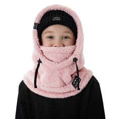 a young boy wearing a pink scarf and black beanie with the hood pulled over his face