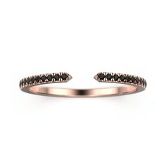 a rose gold ring with black diamonds on the outside, and an open band in the middle