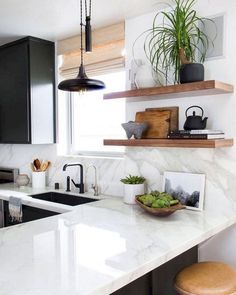 the kitchen counter is clean and ready to be used as a breakfast bar or dining area