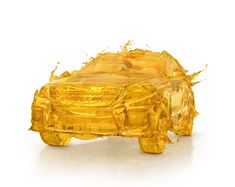 a car covered in yellow liquid on a white background