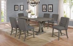 a dining room table with chairs and a chandelier