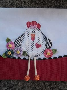 a white chicken with red bow on it's head and flowers in its beak