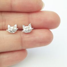 * A beautifully designed stud earrings that makes great everyday wear  * Charm:6mm (sterling silver,Hand made in USA)  * Complimentary gift packaging Sterling Silver Cat Design Earrings For Gift, Silver Plug Earrings As Gift, White Sterling Silver Plug Earrings As Gift, Tiny Silver Plug Earrings Gift, Gift Cat Design Earrings, Silver Plug Earrings Gift, Cute Silver Earrings For Anniversary, Nickel Free Minimalist Plug Earrings As Gift, Dainty Hypoallergenic Plug Earrings As Gift