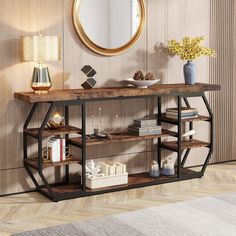 a console table with books, vases and other items on it in front of a mirror